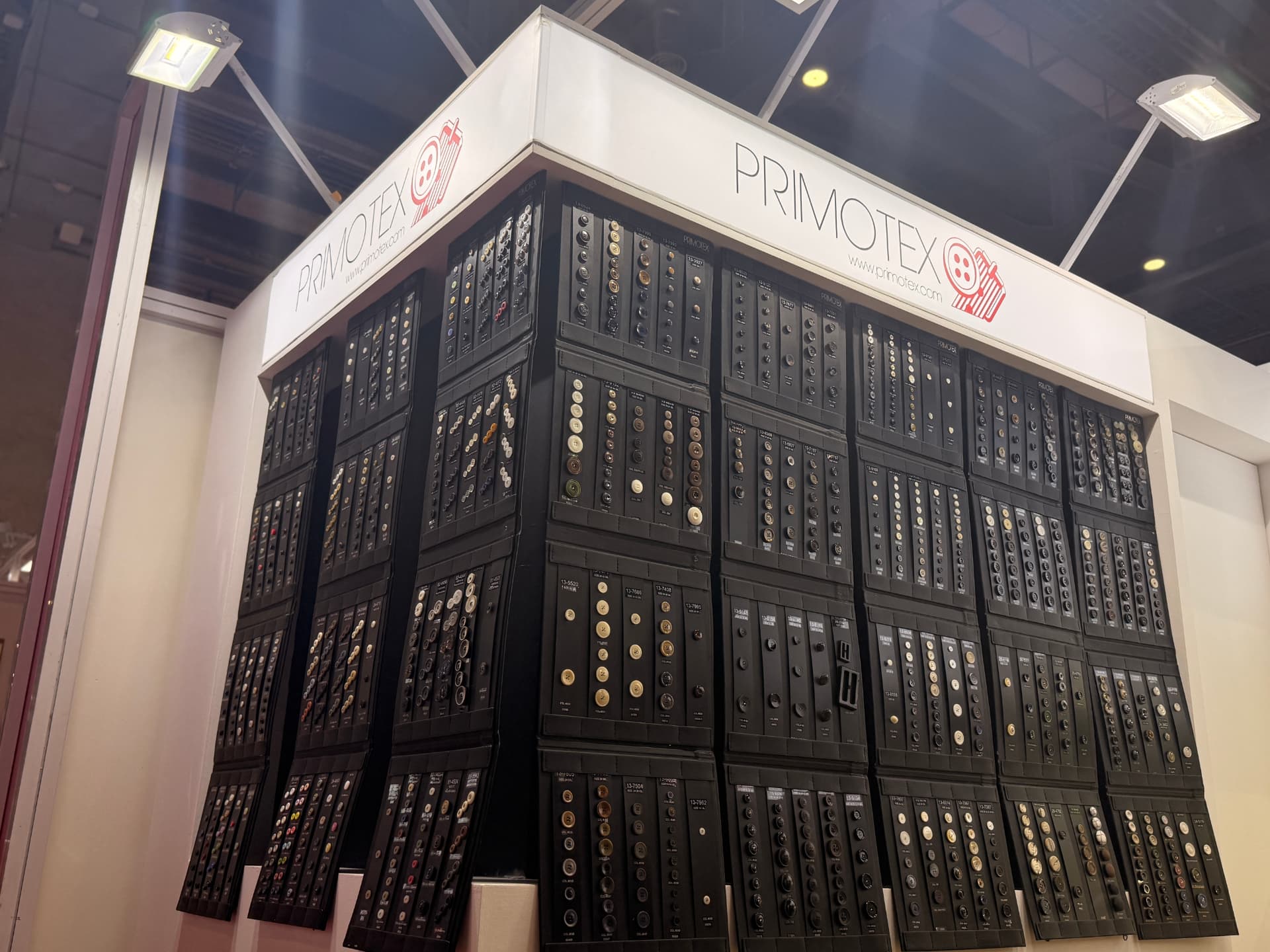 Close-up corner view of the full Primotex button sample wall