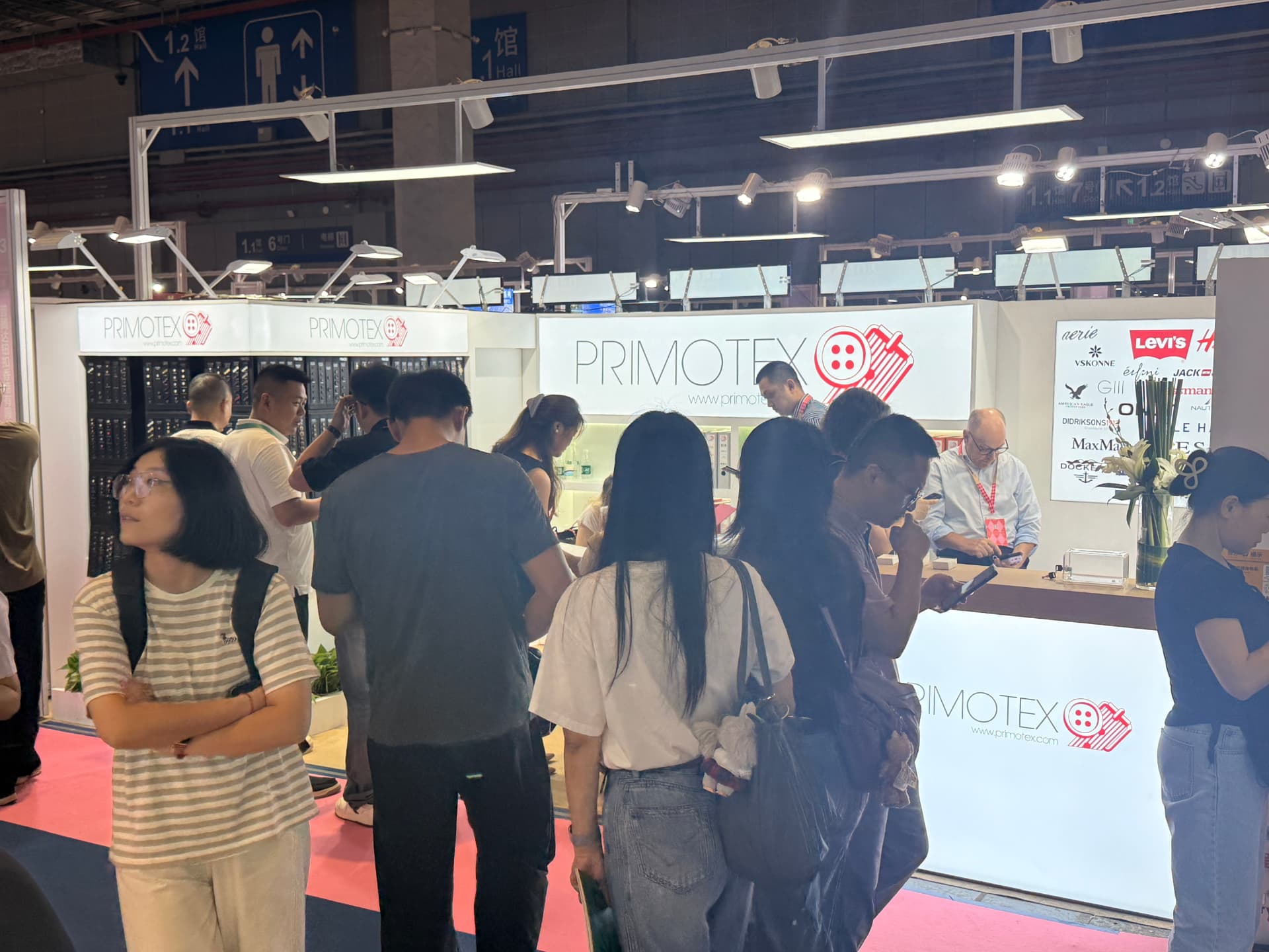 Crowd of visitors in front of the Primotex booth at Intertextile Shanghai